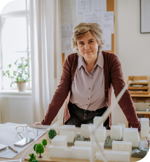 woman with model buildings